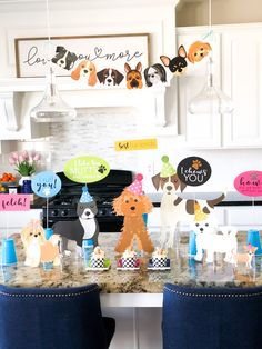 a kitchen counter topped with lots of dogs on top of it's counter tops