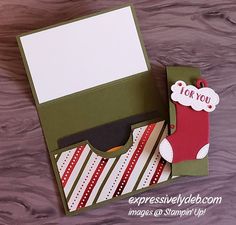 an open card box with a christmas stocking on it