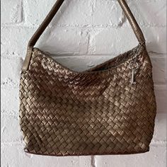 Fossil Key Per Gold Weaved Leather Handbag ; Gold Weaved Leather, Silver Metal, Fossil Hangtag, Zipper Closure, Floral Lining, Zipper Pocket, Pocket Slots. No Rips Or Stains. Nwot. W: 12” H: 7.5” D: 4.5” Handle Drop: 9” Chic Gold Bags With Intrecciato Weave, Gold Woven Leather Shoulder Bag, Gold Woven Leather Bag For Everyday Use, Gold Woven Leather Travel Bag, Elegant Gold Shoulder Bag With Woven Leather, Gold Leather Bag With Woven Detail, Gold Woven Leather Bag, Gold Hobo Bag With Braided Handles For Everyday Use, Gold Hobo Shoulder Bag With Braided Handles