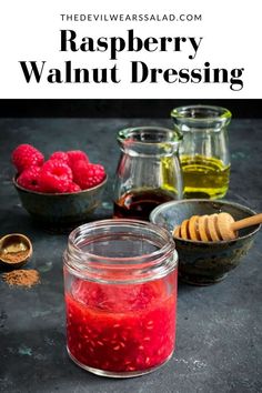 raspberry walnut dressing in a glass jar next to other ingredients