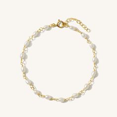 The perfect strand of pearls to adorn your wrist. Comfortable and lightweight - perfect for daily wear. Did we mention - the updated version of this bracelet is 100% gold filled?! You can wear it in the shower, to the gym, and even to sleep with confidence. Style tip - stack it with other gold chain bracelets for gorgeous texture contrast! DETAILS Bracelet length: 6.5" with 1" extender 14k gold filled -or- sterling silver spring clasp, wire, & findings 4x5mm rice freshwater pearls Safe for sensi Dainty Gold Bracelets With Pearl Chain, Gold Pearl Bracelet With Delicate Chain, Delicate Gold Pearl Chain Bracelet, Dainty 14k Gold Bracelet With Pearl Chain, Dainty Gold Plated Pearl Chain Bracelet, Pearl Bracelet Gold, Pearl Chain Necklace, Classic Bracelets, Freshwater Pearl Bracelet