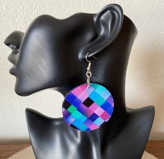 Make a bold, fabulous statement with these colorful lightweight geometric inspired earrings! This one-of-a-kind jewelry works with a wide range of outfits. The earrings were created with 100% cotton fabric and wood.  Fabric is on both side of earrings. Circle measures 2.25" x 2.25". All of our pieces are handmade in our design studio with careful attention to detail and durability.  Additional options available in our shop's Earrings  section. Every set arrives gift wrapped in our signature box.  Orders ship within 1-3 business days.  Domestic US orders include free shipping & tracking.  If you like what you see, please favorite our shop and share with your friends! Please message us below with any questions at Anzhlay Designs. https://www.etsy.com/shop/anzhlaydesigns Modern Multicolor Single Earring, Bold Geometric Earrings With Bold Design, Modern Multicolor Jewelry With Bold Design, Bold Geometric Designed Earrings, Modern Multicolor Geometric Jewelry, Multicolor Geometric Earrings For Gift, Geometric Multicolor Earrings For Gift, Modern Multicolor Earrings With Bold Design, Geometric Multicolor Earrings As Gift