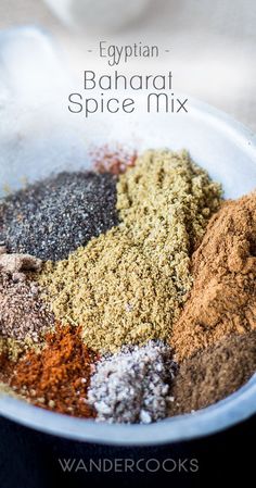 an assortment of spices in a bowl with the words egyptian banarat spice mix