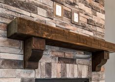 a fire place with a brick fireplace and wooden mantle