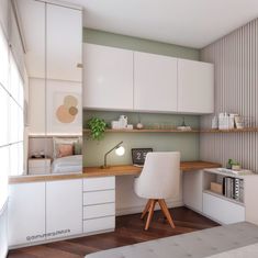 a room with white cabinets and a desk