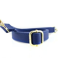 This slick crossbody features a clear PVC body with classic accents of coated cotton canvas and gold hardware. Easily convert your accessory from a crossbody to a clutch with the adjustable and detachable coated cotton canvas strap. The royal blue accents help it give it the extra pop for style. Measures 8" x 6” x 1.6" Blue Shoulder Bag With Metal Hardware For Travel, Detachable Crossbody Bag Strap For School, Everyday Blue Crossbody Bag Strap, Gold Detachable Bag Strap For Travel, Gold Shoulder Bag With Detachable Adjustable Strap, Blue Adjustable Bag Strap For Everyday Use, Blue Adjustable Strap Bag Strap For Everyday Use, Blue Crossbody Bag Strap For Everyday Use, Blue Adjustable Shoulder Strap With Detachable Option