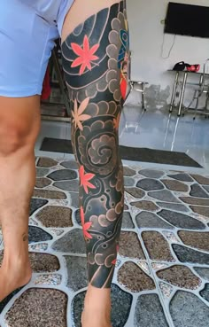 a person with tattoos on their legs and feet