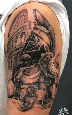 a man's arm with a black and white tattoo on it, depicting a roman soldier