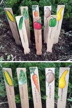 several wooden sticks with vegetables painted on them in front of some grass and bushes, one has carrots, the other has corn