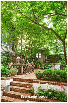 an outdoor garden with steps leading up to the deck and seating area, surrounded by greenery