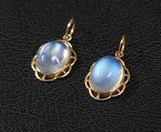 1. Rainbow Moonstone 14k Gold Pendant 2. Made to Order 3. Gemstone - Rainbow Moonstone 4. Jewelry Type - Pendant 5. Total Weight - 1.325 Grams Approx. 6. Moonstone Weight - 3.32 Carats Approx. 7. Gold Weight - 0.661 Grams Approx. 8. Moonstone Size - 8x10 MM 9. Gold Purity - 14k 10. Pendant Bails Size - 6 mm 11. Inclusion based 12. Ready to dispatch in 3 - 5 days. 13. Handmade Items 14. AA Quality Pendant 15. 2 Quantity Available  16. Women Gold Pendant   Pictures are taken under natural and day Yellow Gold Oval Cabochon Moonstone Ring, Elegant Yellow Gold Oval Cabochons, Celestial Hallmarked Jewelry With Oval Stones, Oval Moonstone Yellow Gold Jewelry, Yellow Gold Moonstone Jewelry With Oval Shape, Yellow Gold Oval Cabochon Gemstones, Celestial Style Hallmarked Oval Jewelry, Formal Yellow Gold Moonstone Jewelry, Celestial Oval Jewelry With Natural Stones