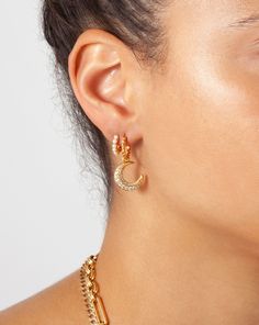 Harris Reed Moonlight Pearl Earring Set | 18ct Gold Plated Vermeil/Pearl. A Celestial Ear Stack Set You'll Never Want to Take Off. The Harris Reed Moonlight Hoop Earrings Make a Unique Impact Paired with the Pearl Gemstone Huggies. Save More When Buying Them Together. Metal: Harris Reed Moonlight Hoop Earrings & Pearl Gemstone Huggies are 18Ct Recycled Gold Plated Vermeil on Recycled Sterling Silver Charm Metal: 18Ct Recycled Gold Plated on Brass Stones: Pearl and Cubic Zirconia Harris Reed Moon Elegant Gold-plated Crescent Earrings, Elegant Gold Plated Crescent Earrings, Yellow Gold-plated Moon Charm Earrings, Elegant Moon Charm Drop Earrings, Moon-shaped Yellow Gold Plated Earrings, Moon Shaped Yellow Gold Plated Earrings, Elegant Crescent Moon Charm Earrings, Yellow Gold Plated Earrings With Moon Charm, Gold Plated Yellow Gold Earrings With Moon Charm