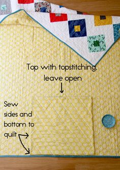 a close up of a piece of fabric with words on it that read top with topstitching, leave open sew sides and bottom to quilt