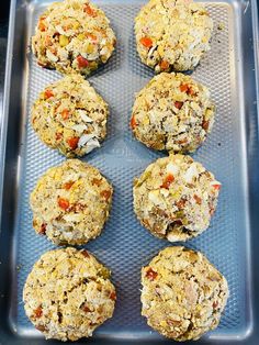 six cookies on a baking sheet ready to go into the oven, with toppings