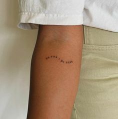 a person with a small tattoo on their arm