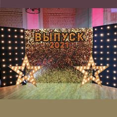 the stage is decorated with lights and stars for an upcoming year's eve celebration