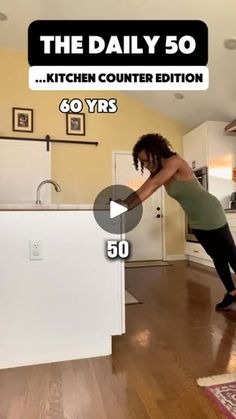 a woman is dancing on the kitchen counter