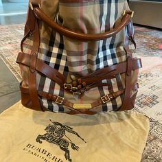 This Is A One Owner Bag Bought From Burberry In Nashville. Great Condition! Classic Burberry Canvas Print And Leather. Black Canvas Liner In Perfect Condition. 15” Long Let Me Know If You Need Any Other Information Black Canvas, Burberry Bag, Let Me Know, Nashville, Burberry, Canvas Print, Bag Lady, Let Me, Canvas Prints