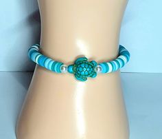 SAVE THE TURTLES  A cute blue turtle bracket 💙 Blue Adjustable Novelty Jewelry, Blue Adjustable Novelty Bracelet, Blue Adjustable Novelty Bracelets, Hibiscus Jewelry, Clay Bead Bracelet Ideas, Bead Bracelet Ideas, Save The Turtles, Ocean Turtle, Clay Bead Necklace