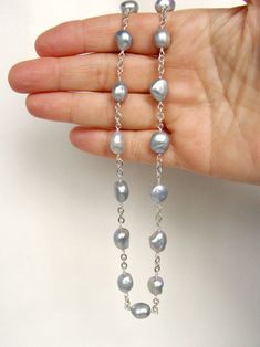 Baroque pearl necklace, silver gray free form pearls, fabulous style for anytime, handmade, Let Loose Jewelry, sterling silver Baroque silver gray pearls for everyday style~ this 19.25 inch necklace can go from jeans and a sweater to an elegant evening look. These pearls are an impressive 10-11mm...just the right amount of substantial, The pearls are linked with Argentium silver onto heavy, flat cable links of sterling silver. The clasp is a user-friendly 13mm and it hooks to a 13mm infinity lin Grey Pearls Jewelry, Silver Necklace With Sterling Silver Clasp And Baroque Pearl, Silver Single Strand Baroque Pearl Jewelry, Gray Single Strand Pearl Necklace As Gift, Handmade Silver Jewelry With Baroque Pearls, Graduated Pearl Necklace, Pearl Necklace Silver, Wire Ideas, Silver Pearl Jewelry