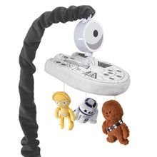 a star wars mobile with three stuffed animals hanging from it's side and one toy in the foreground