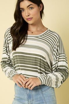 Stay stylish and comfy with our Olive Stripe Slouch Tee. This oversized, long sleeve shirt features a ribbed texture and round neck, perfect for a casual and relaxed look. (Pun intended) Get ready to slouch in style! Made in the USA Relaxed Tops For Casual Fall Gatherings, Relaxed Fall Tops For Casual Gatherings, Casual Striped Ribbed Tops, Trendy Long Sleeve Tops With Ribbed Neckline, Trendy Long Sleeve Top With Ribbed Neckline, Green Soft Knit Long Sleeve Top, Green Long Sleeve Soft Knit Top, Trendy Waffle Knit Tops For Fall, Green Casual Long Sleeve Top For Layering