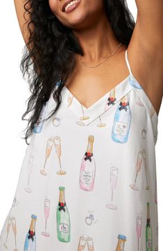 Start your new life together with plenty of sparkling toasts and time spent in this playful organic-cotton jersey chemise topped with dainty straps. 34" length V-neck Adjustable straps 93% organic cotton, 7% elastane Machine wash, tumble dry Imported Summer Sleep Tops With Delicate Straps, Summer Sleepwear With Delicate Straps For Loungewear, Summer Sleep Tops With Adjustable Straps, Party Sleepwear Camisole With Delicate Straps, Summer Nightgown With Delicate Straps For Loungewear, Summer Cotton Camisole For Sleepovers, Cotton Camisole With Spaghetti Straps For Party, Feminine Summer Party Sleepwear, Delicate Straps Camisole For Brunch