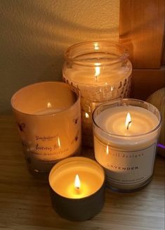 three candles sitting next to each other on a table