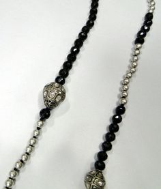 Designer 925 sterling silver and Genuine uncut Diamond set beads, Black spinal Gemstones beads, sterling silver Beads Strand. Beautiful one of the kind piece in very good condition. Length-74 cm( we can adjust length). Size of Diamond bead-17/21 MM and 13/16 MM, size of black gemstone beads-8 Unique Silver Jewelry With Black Beads, Silver Beaded Necklace With Black Beads In Sterling Silver, Sterling Silver Beaded Necklaces With Black Beads, Sterling Silver Beaded Necklace With Black Beads, Silver Long Beaded Necklace With Black Beads, Unique Silver Beaded Necklace With Faceted Beads, Silver Sterling Silver Gemstone Beaded Necklaces, Silver Sterling Beaded Necklaces With Gemstone Beads, Silver Sterling Silver Necklace With Gemstone Beads