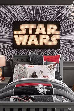 a star wars themed bedroom with the lights on