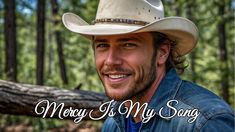 a man wearing a cowboy hat with the words merry is my song