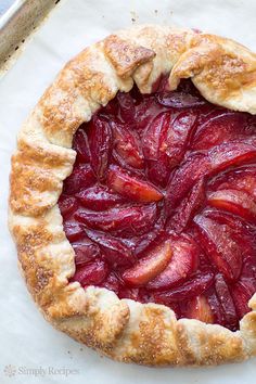 a pie that has some fruit on it