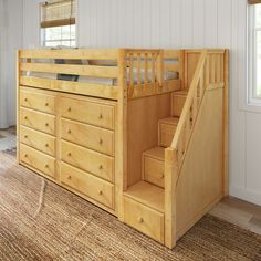 there is a bunk bed with stairs to the top and bottom drawers on each side