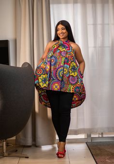 African print cotton. Hi lo hi neck top. Loose fit. Pockets. Model wears L. Top Length approximately S/M: 25/37L/XL: 26/382XL/3XL: 27/39 Disclaimer: Photo may slightly differ from actual item in terms of color due to lighting during photo shoot or monitor display. Ankara Top Styles, Ankara Blouses, African Print Shirt, Latest Aso Ebi Styles, African Blouses, Ankara Tops, African Tops, African Print Tops, African Inspired Clothing