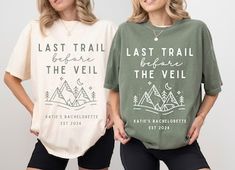 two women standing next to each other wearing t - shirts that say last trail before the veil