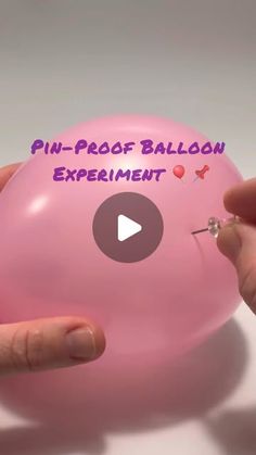 someone is holding a pink balloon with the words pin - proof balloon experiment on it