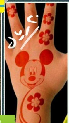 a hand with mickey mouse painted on it and the words disney written in different languages