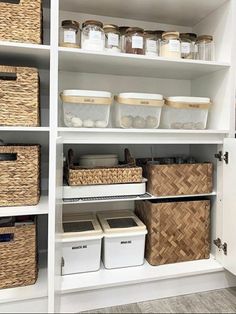 an organized pantry with baskets and bins