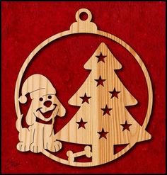 a wooden ornament with a dog sitting next to a christmas tree and stars