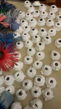 several rolls of toilet paper with red, white and blue spools on them