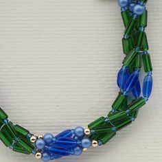 Vintage Czech 4 strand necklace blue green pearl glass beads Green Oval Beaded Chain Jewelry, Blue-green Round Beads Jewelry For Gifts, Blue-green Round Beads Jewelry Gift, Green Multi-strand Beaded Bracelets, Blue Multi-strand Czech Glass Jewelry, Green Multi-strand Beads For Jewelry Making, Blue Multi-strand Jewelry With Czech Glass, Green Double Strand Beaded Necklace, Green Multi-strand Costume Jewelry