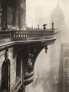 an old black and white photo of people standing on the top of a building in new york city