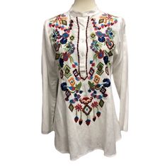 Women’s A & A White Button Neckline Tunic With Embroidered Flowers Long Sleeves New With Tags Attached Various Sizes 100% Viscose Approximate Measurements Taken Flat Small Armpit To Armpit 18”, Length 26” Medium Armpit To Armpit 20”, Length 26” X Large Armpit To Armpit 22”, Length 27” Arrives Clean And Ready To Wear From A Smoke Free Environment White Long Sleeve Embroidered Top With Floral Print, White Long Sleeve Top With Floral Embroidery, White Floral Print Tunic Blouse, White Long Sleeve Top With Embroidered Hem, White Bohemian Embroidered Tunic Top, Bohemian White Embroidered Tunic Top, White Casual Top With Floral Embroidery, White Casual Embroidered Top With Floral Print, White Long Sleeve Top With Embroidered Neckline