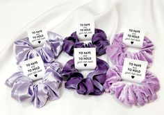 four scrunffles with tags on them sitting on a white sheet that says to have to have to hold