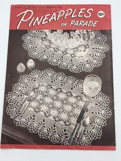 an old book with crocheted doily on the front and back cover showing pineapples on parade