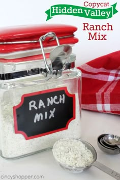 a jar filled with ranch mix next to a measuring spoon