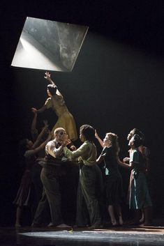 a group of people standing on top of a stage