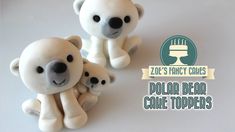 two white bears sitting next to each other on top of a table with the caption zoo's fancy cakes polar bear cake toppers