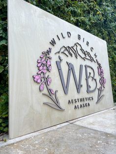 the sign for wild biscuits is shown in front of some bushes