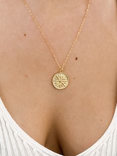 "Gold Sun Necklace, Coin Necklace, gold necklace, layering necklace, sun necklace, gold coin necklace, medallion necklace, dainty gold jewelry, minimal jewelry ♥Beautiful and delicate sun medallion gold disc necklace ♥Wear this necklace alone or layer it with your favorites. ♥A delicate 14k gold filled chain, with a hint of shimmer adorned with a gold filled disc pendant ♥Pendant measures 18mm x 22mm - about the size of a penny ♥LENGTH - The moon necklace shown on the model is 18\" long. Please Dainty Yellow Gold Necklace With Sun And Moon Design, Dainty Gold Charm Necklace With Sun And Moon Design, Gold Charm Necklace With Sun Design, Gold Plated Sun Design Necklace As Gift, Gold Plated Sun Design Necklace Gift, Dainty Sun And Moon Design Charm Necklaces, Minimalist Gold Charm Necklace With Sun And Moon Design, Gold Necklace With Sun Design Round Pendant, Dainty Sun And Moon Design Charm Necklaces For Everyday